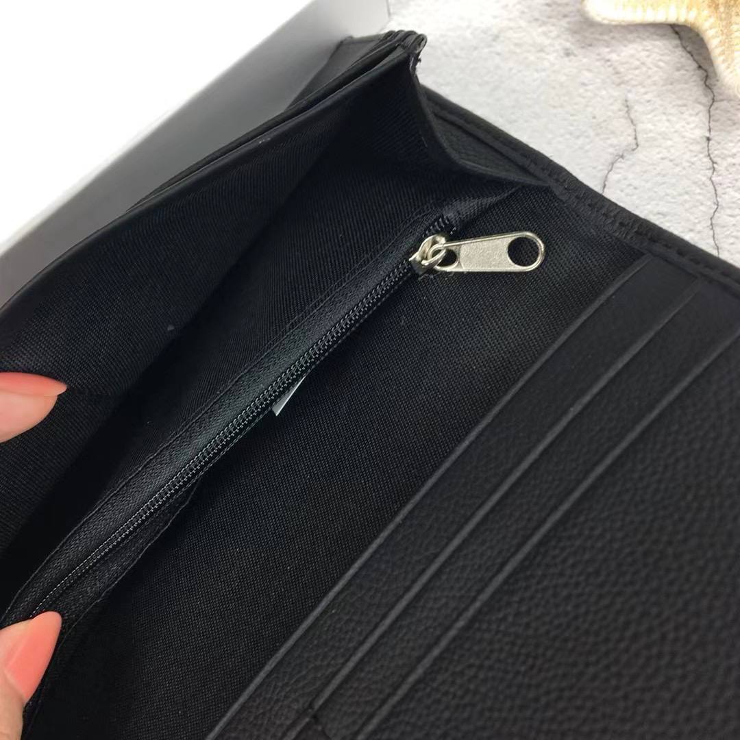 Close up of hidden interior zipper pocket inside Calvin Klein Long Wallet