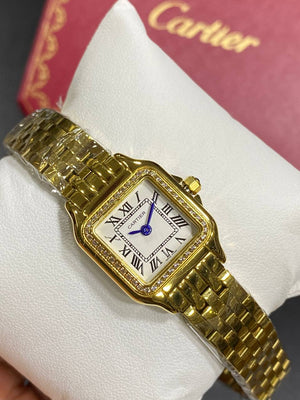 Cartier Panthère de Cartier women's quartz watch, small model case, silver dial, stone-set bezel, gold-tone bracelet – in hand view