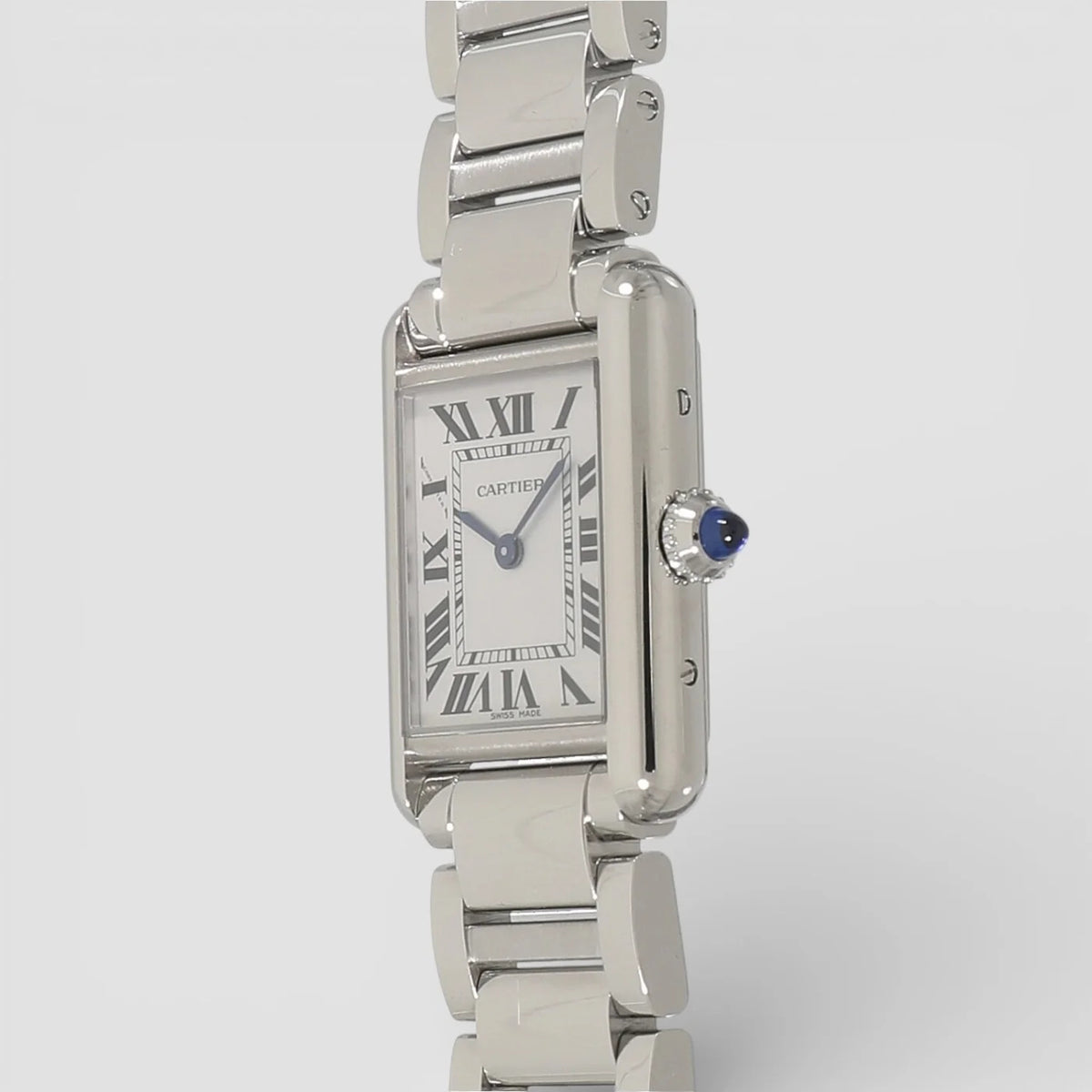 Cartier Tank Must men's quartz watch, large model case, silver dial, silver stainless steel bracelet – angle view