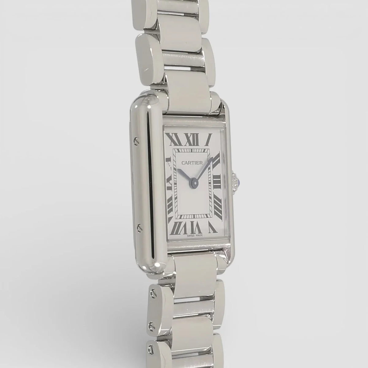 Cartier Tank Must men's quartz watch, large model case, silver dial, silver stainless steel bracelet – left angle view