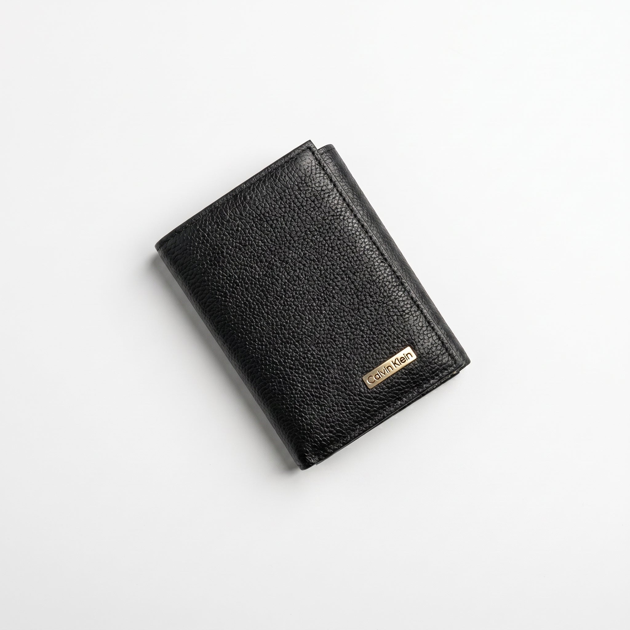Black leather wallet with a brand logo on a light gray background