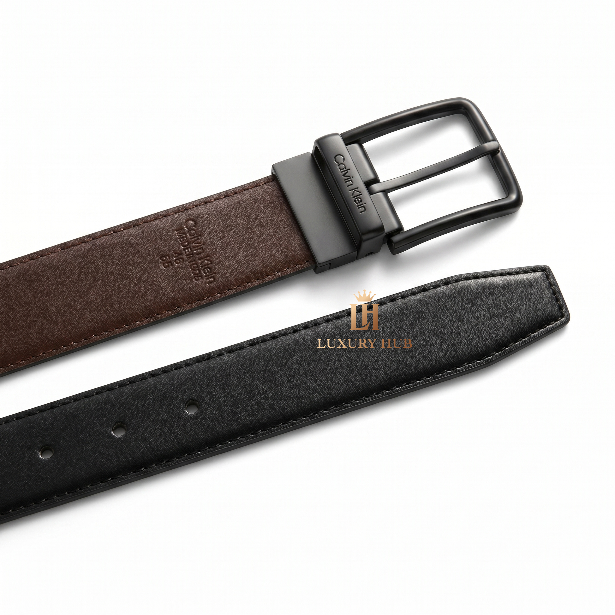 Detailed view of the Calvin Klein double-face leather belt showing the reversible black and brown premium leather sides