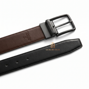 Detailed view of the Calvin Klein double-face leather belt showing the reversible black and brown premium leather sides