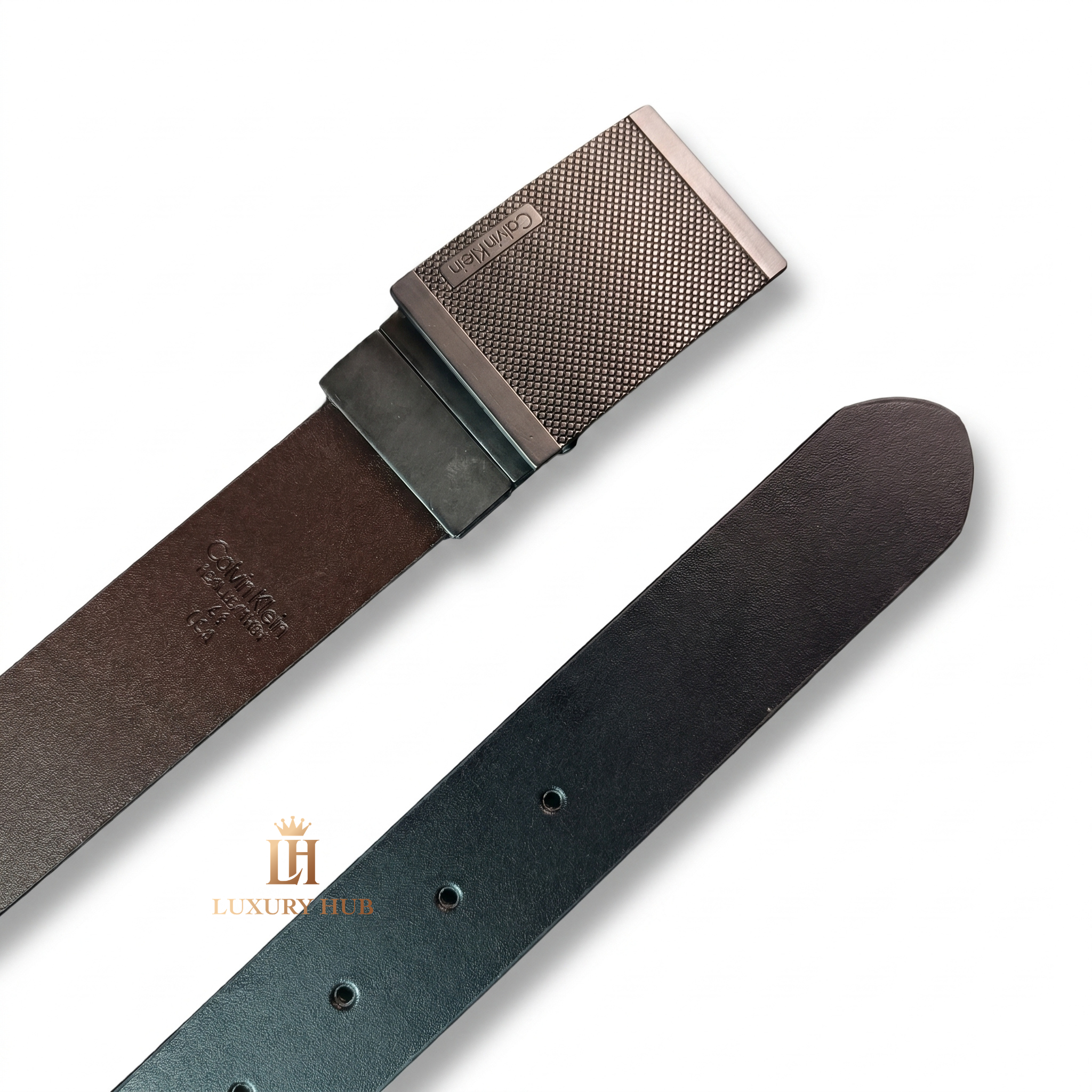 Close-up view of the Calvin Klein double-face leather belt showing the reversible black and brown premium leather sides