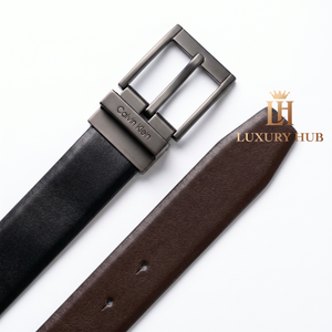 Detailed view of the Calvin Klein double-face belt showing both black and brown leather sides