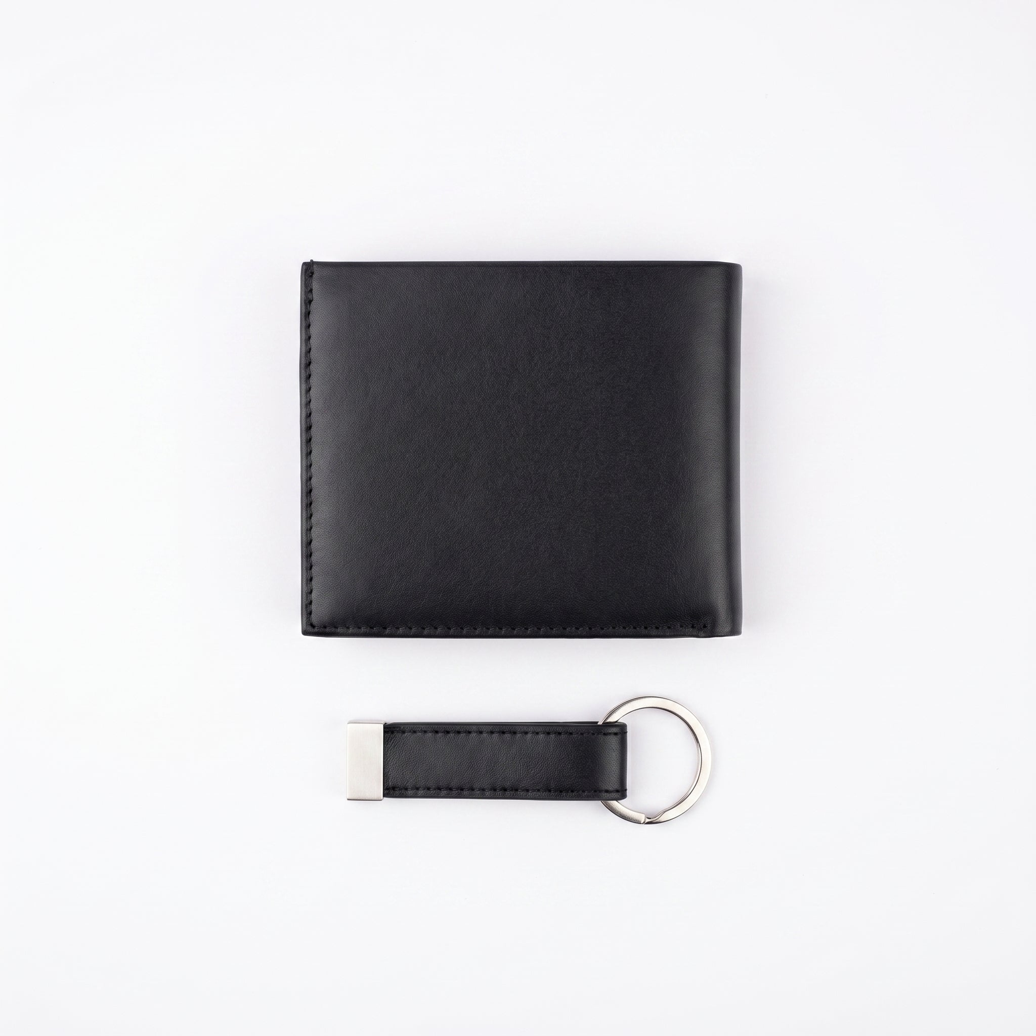Back view of the Calvin Klein genuine leather wallet and key fob showing the sleek minimalist design and clean stitched edges