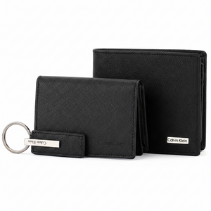Side perspective of the standing Calvin Klein black saffiano leather wallet and card holder set with a matching silver-accented leather keychain