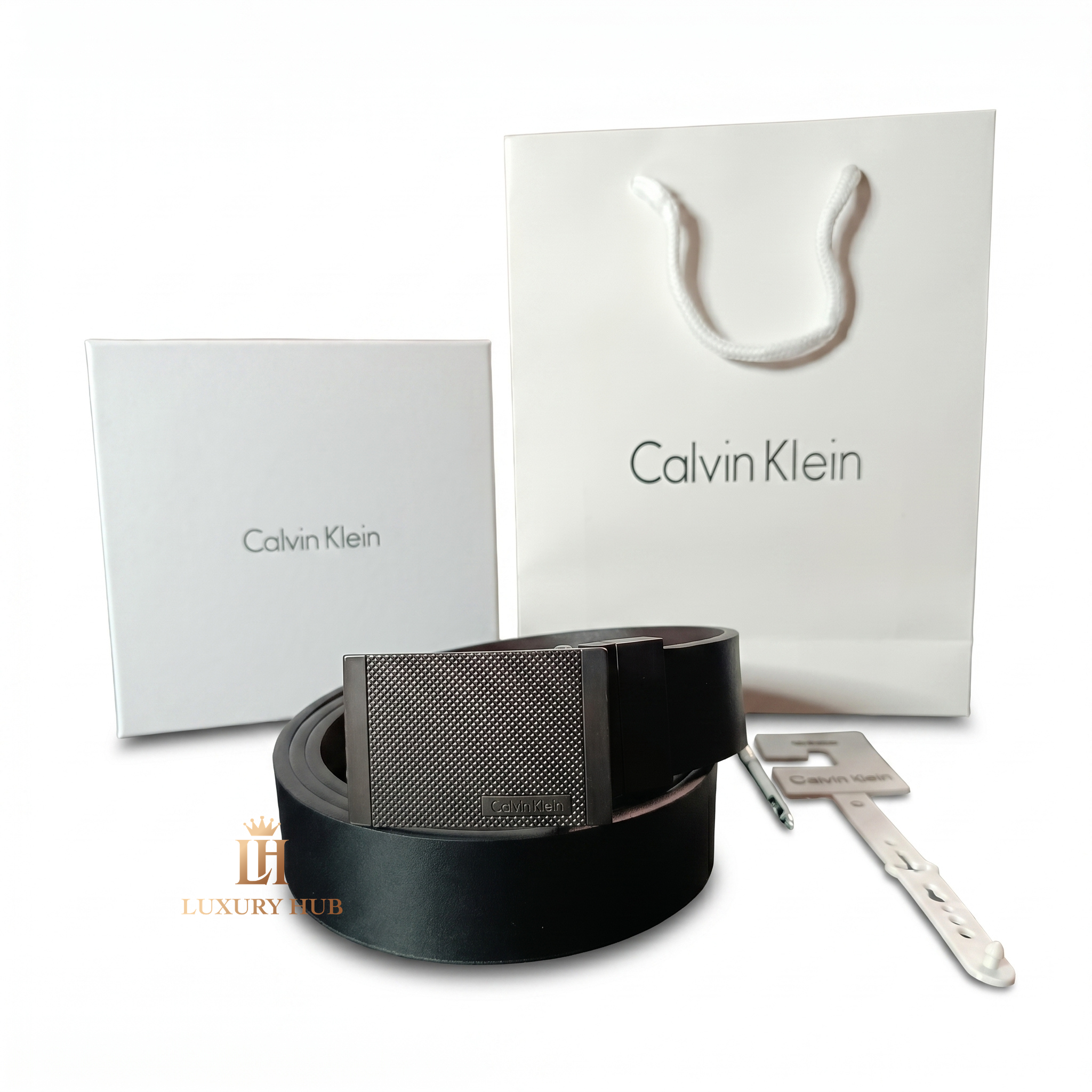 Professional standing view of the Calvin Klein mirror original reversible leather belt featuring the matte textured buckle