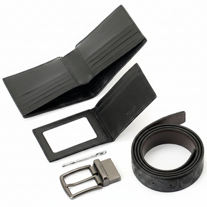 Full Coach gift set contents showing belt buckle wallet card holder and adjustment tool