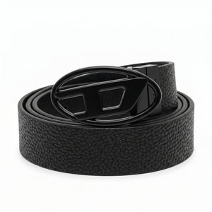 Front view studio product photograph of the Diesel mirror original pebbled black leather belt rolled flat with the oversized D logo buckle centered