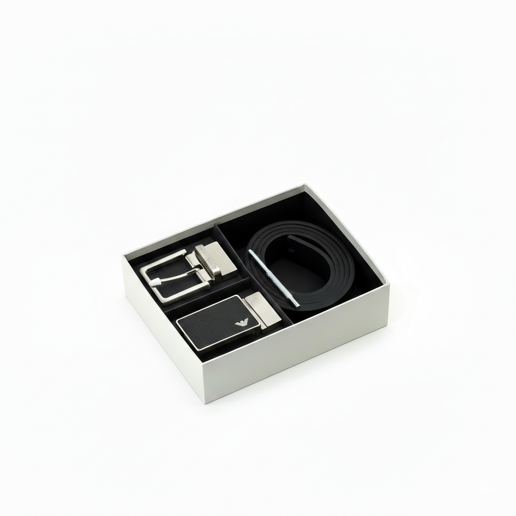 Emporio Armani men's luxury gift set featuring a black textured leather belt and two interchangeable silver metal buckles inside a premium branded presentation box
