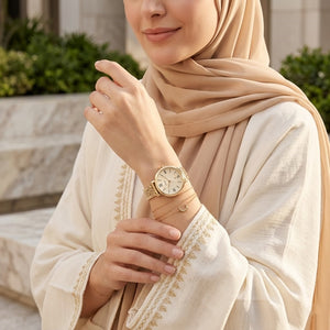 Lifestyle photo of Fossil ES3434 showing the watch on a woman's wrist with gold bracelet