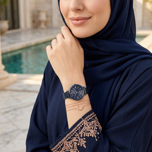 Lifestyle photo of Fossil ES4094 showing the watch on a woman's wrist with navy blue bracelet