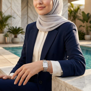 Lifestyle photo of Fossil Raquel ES5221 showing the watch on a woman's wrist with silver bracelet