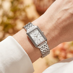 Close up shot of Fossil Raquel ES5221 on wrist showing rectangular silver case and white dial