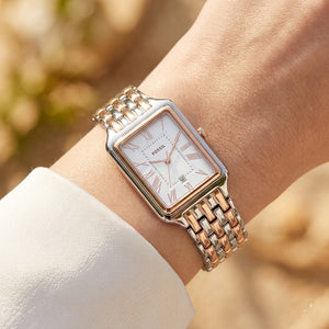 Close up shot of Fossil Raquel ES5222 on wrist showing rectangular two-tone case and roman numerals