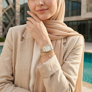 Lifestyle photo of Fossil Raquel ES5305 showing the watch on a woman's wrist with two-tone bracelet