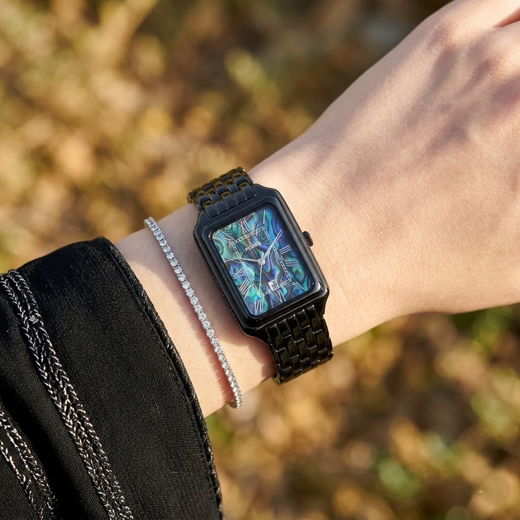 Close up shot of Fossil Raquel ES5340 on wrist showing rectangular black case and unique dial patterns