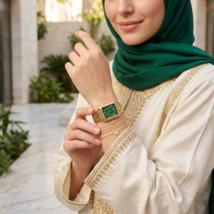 Lifestyle photo of Fossil Raquel ES5341 showing the watch on a woman's wrist with gold bracelet