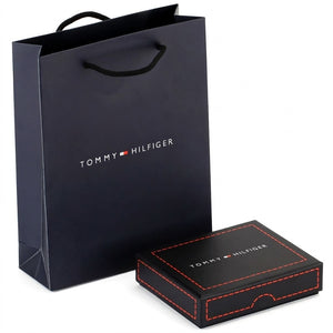 Tommy Hilfiger branded black shopping bag and box on a white background