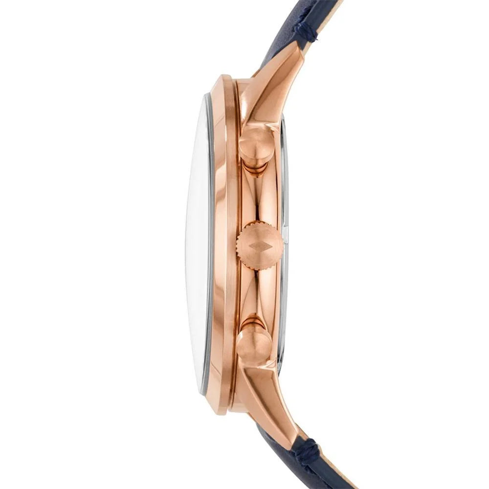 Side profile of a wristwatch with a rose gold case, a clear crystal, and a dark navy blue leather strap on a white background.