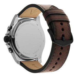 Close-up of a brown leather watch with visible brand name on a white background