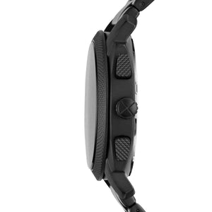 Close-up of a black watch with textured buttons on a white background