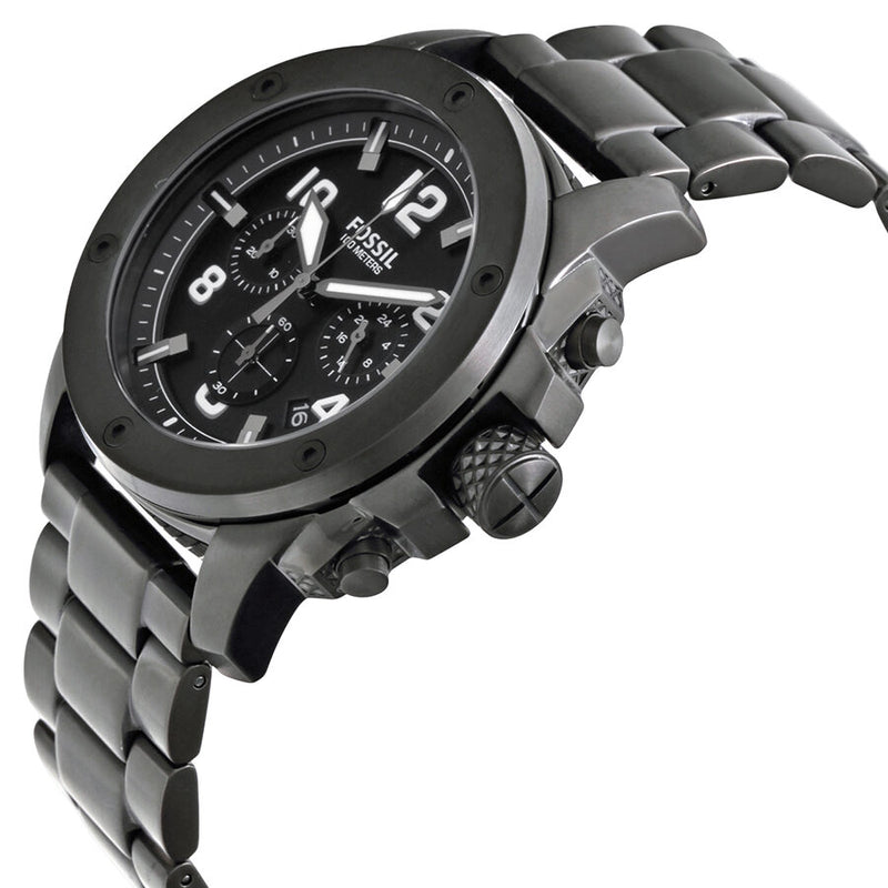 Angled real-life photo of Fossil FS4927 showing the industrial black case and bracelet texture