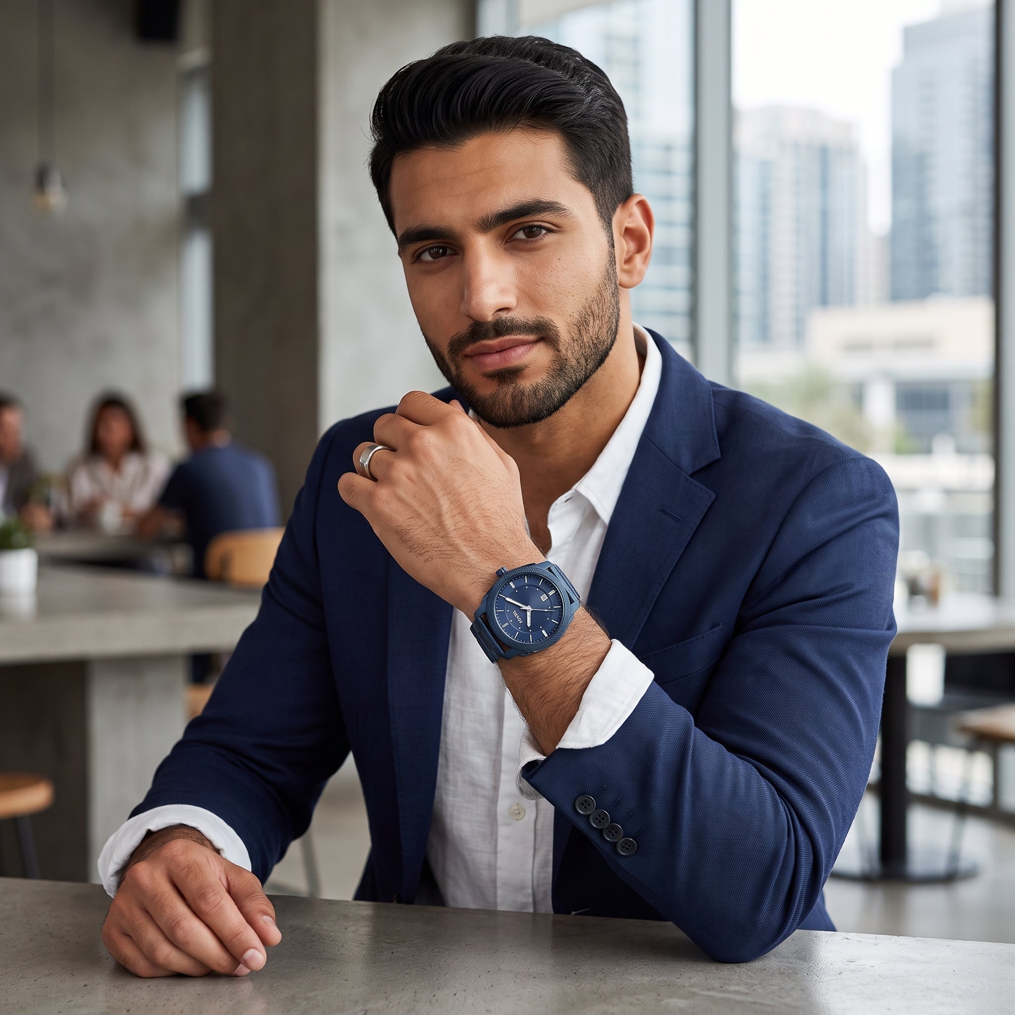 Lifestyle luxury shot of Fossil Machine FS5231 men's watch with blue dial and blue stainless steel bracelet.