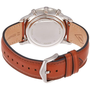 Close-up of a watch with a brown leather strap and silver case on a white background