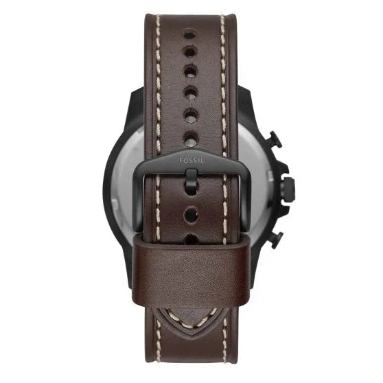 A close-up rear view of a watch with a dark brown leather strap, featuring light contrast stitching and a black buckle with the brand name 'FOSSIL' embossed on it, set against a plain white background.