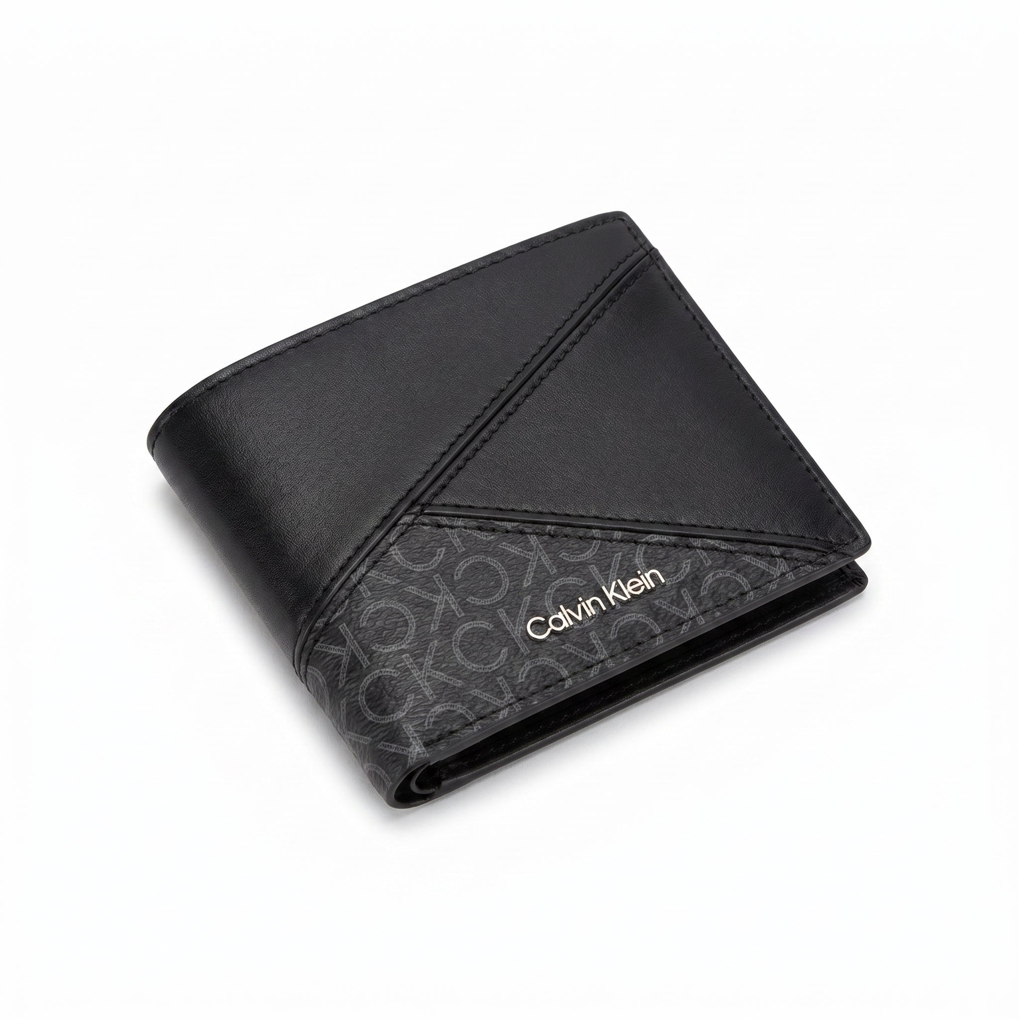 Professional angled studio photograph of the sleek Calvin Klein mirror original smooth black leather bifold wallet