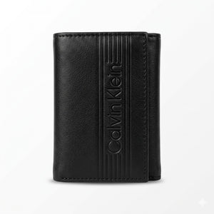 Straight front view product photography of the Calvin Klein black leather trifold wallet showcasing smooth finish and debossed linear logo