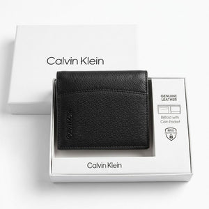 Black Calvin Klein wallet in a branded box on a white background
