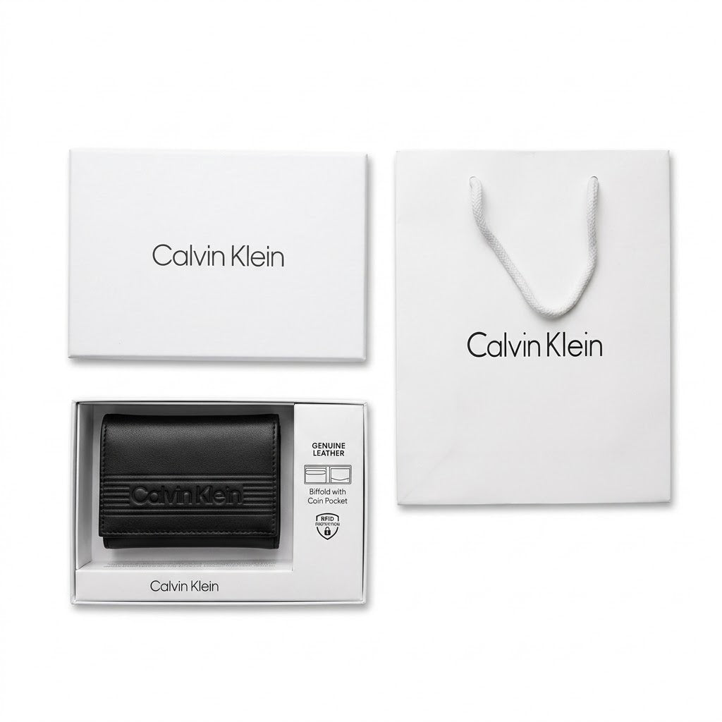 Full premium presentation of the Calvin Klein mirror original smooth black leather trifold wallet set with its white gift box and shopping bag