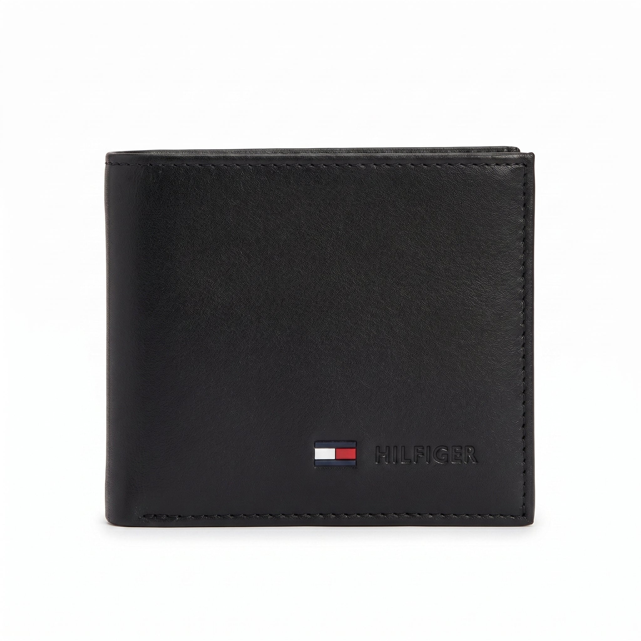 Straight front view product photography of the Tommy Hilfiger black smooth leather wallet highlighting the vertical woven signature stripe and metal flag logo