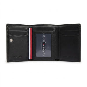 Internal trifold layout view of the Tommy Hilfiger leather wallet showcasing multiple card slots, snap button coin pocket, and clear ID window