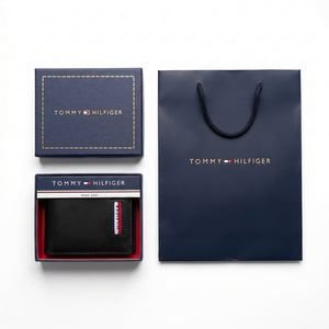 Full premium presentation of the Tommy Hilfiger mirror original saffiano and smooth leather trifold wallet set with its navy gift box and shopping bag