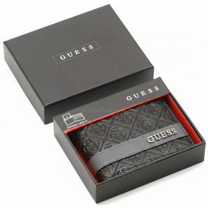 Angled view of a Guess men's black embossed leather passcase wallet sitting securely inside its original black and red gift box