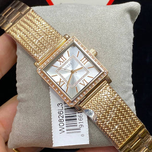 Authentic real-life photo of the Guess Chelsea W0826L3 watch showing actual rose gold finish and crystals