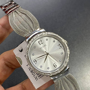 Authentic real-life photo of the Guess Chiffon W1083L1 watch showing actual silver mesh finish