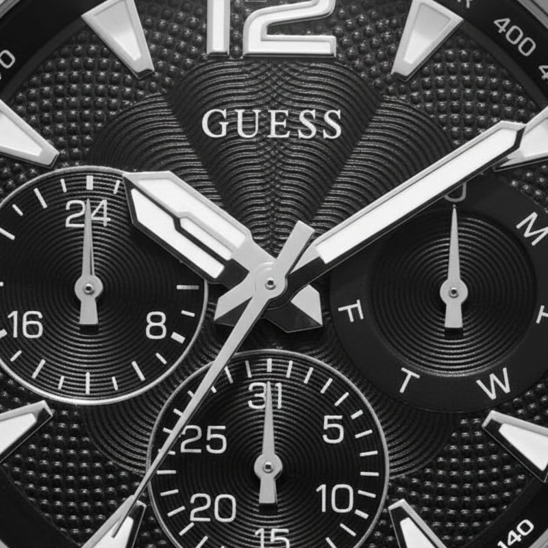 Authentic real-life photo of the Guess Commander GW0056G1 watch showing actual silver shine and black dial