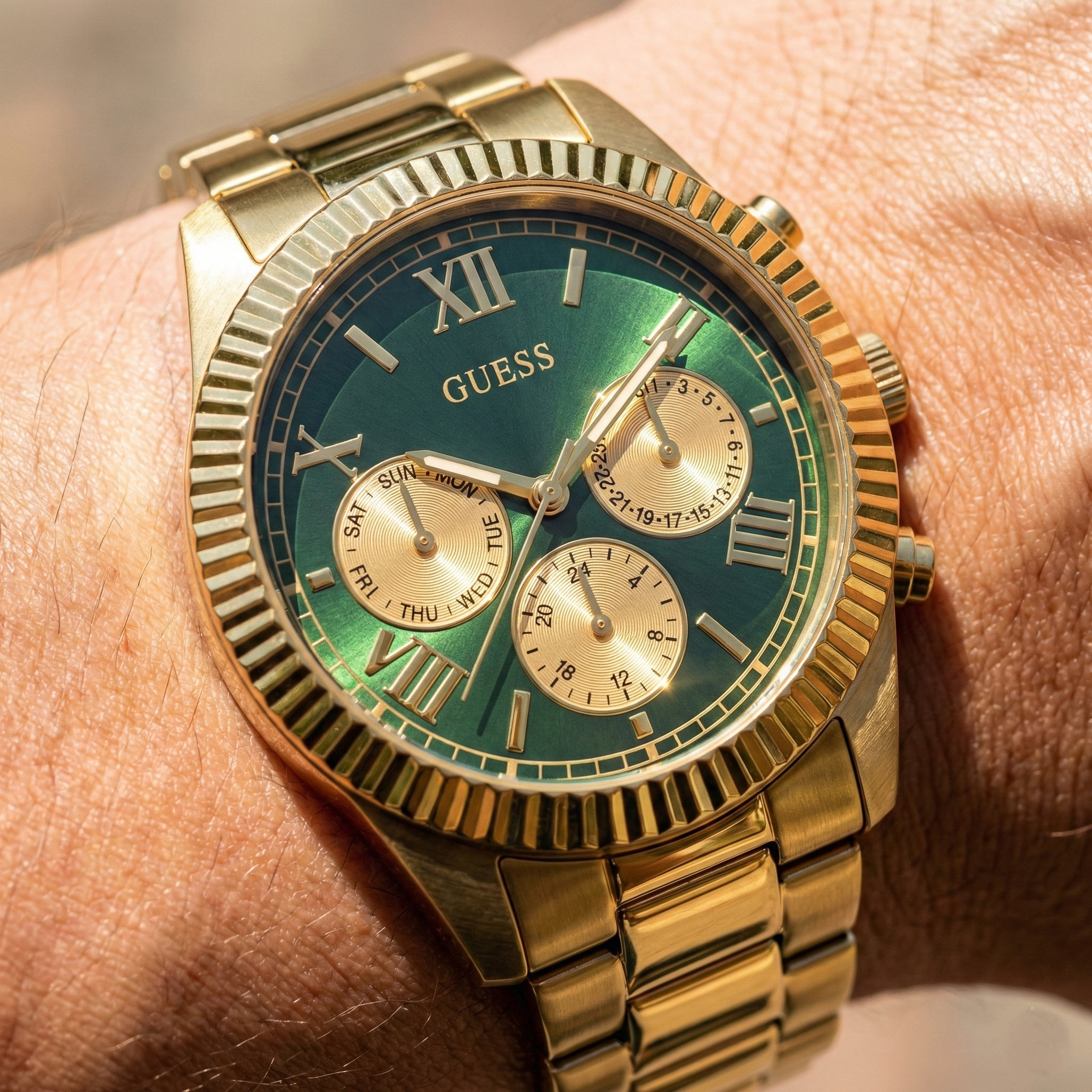 Close up shot of Guess Equity GW0703G2 watch on wrist showing the textured fluted bezel and green dial