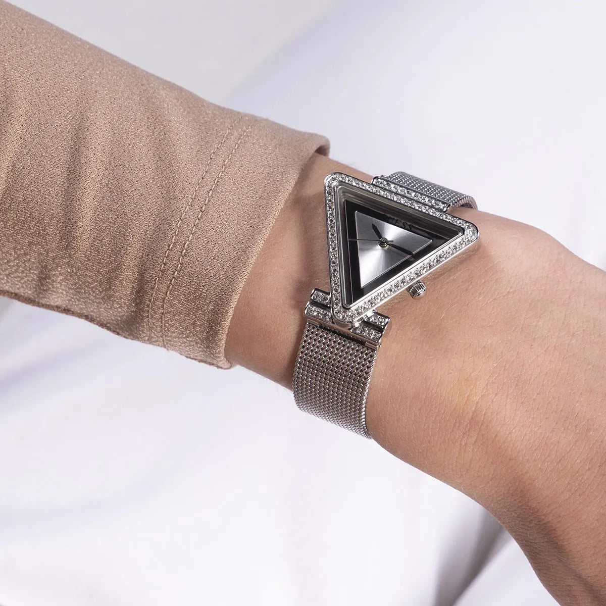 Close up shot of Guess Fame GW0508L1 watch on wrist showing the unique triangle shape and crystals