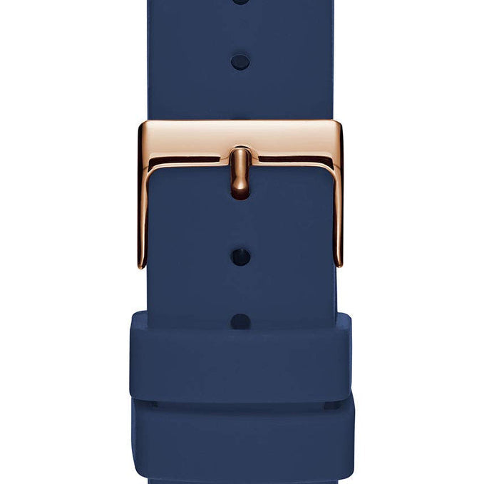 Rose gold tone stainless steel buckle clasp with Guess logo on the blue silicone strap of the W0911L6