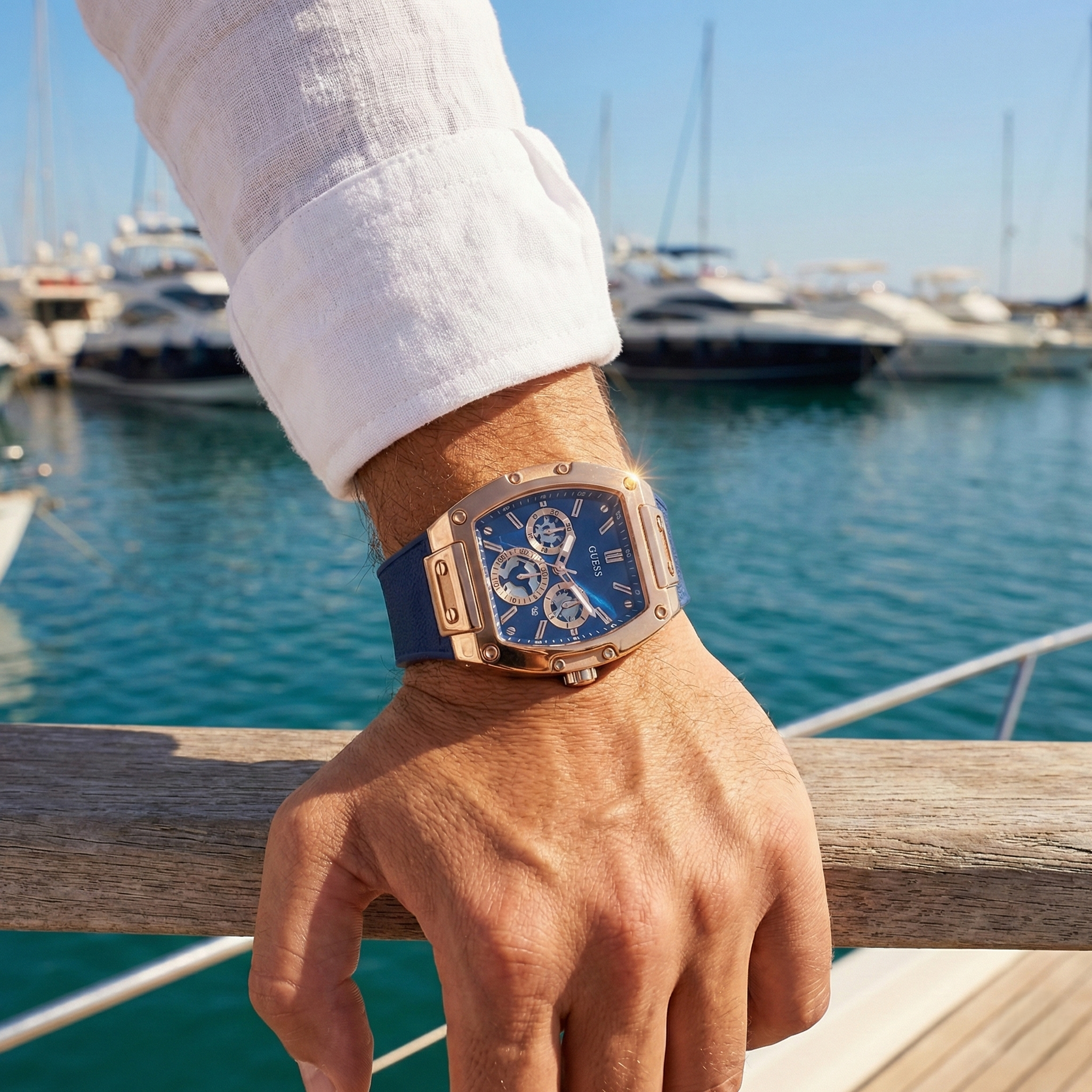 AI lifestyle shot of a man wearing Guess Phoenix GW0202G4 rose gold watch