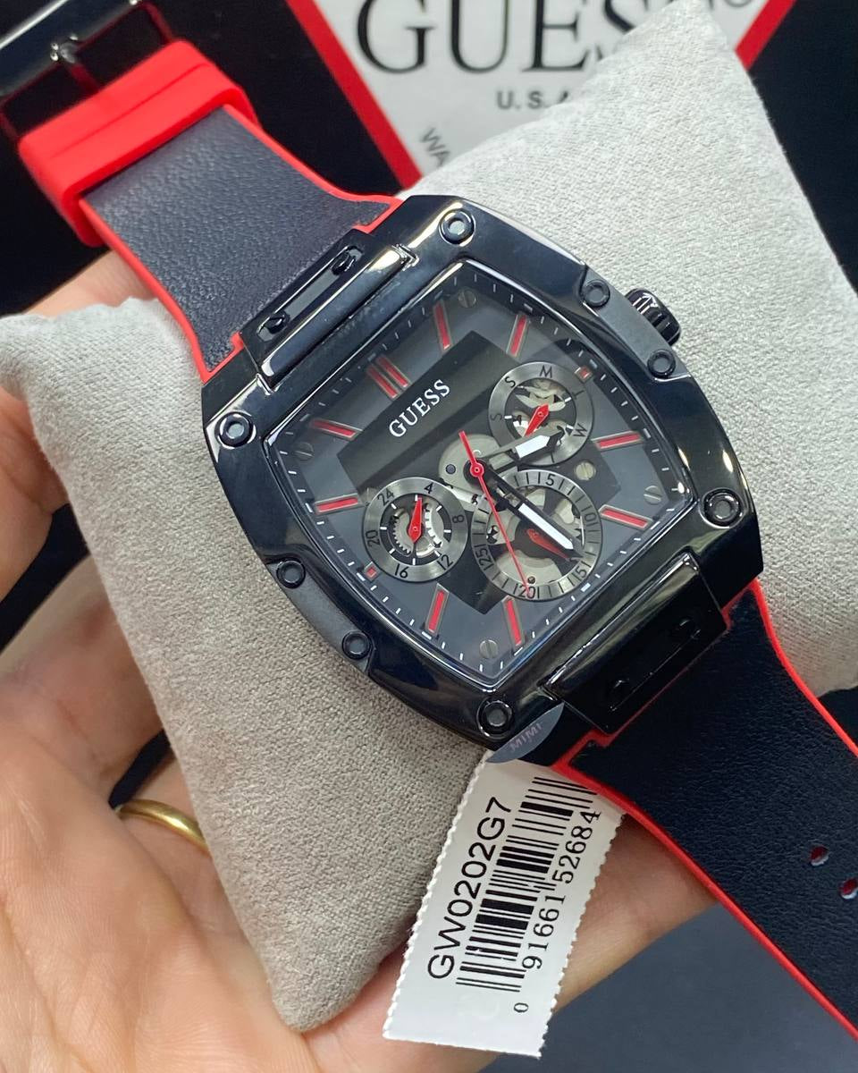 Authentic real-life photo of the Guess GW0202G7 showing actual black rubber texture and red accents in Egypt