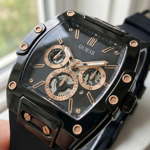 Close up shot of Guess GW0203G8 on wrist highlighting the black skeleton dial and rose gold hands