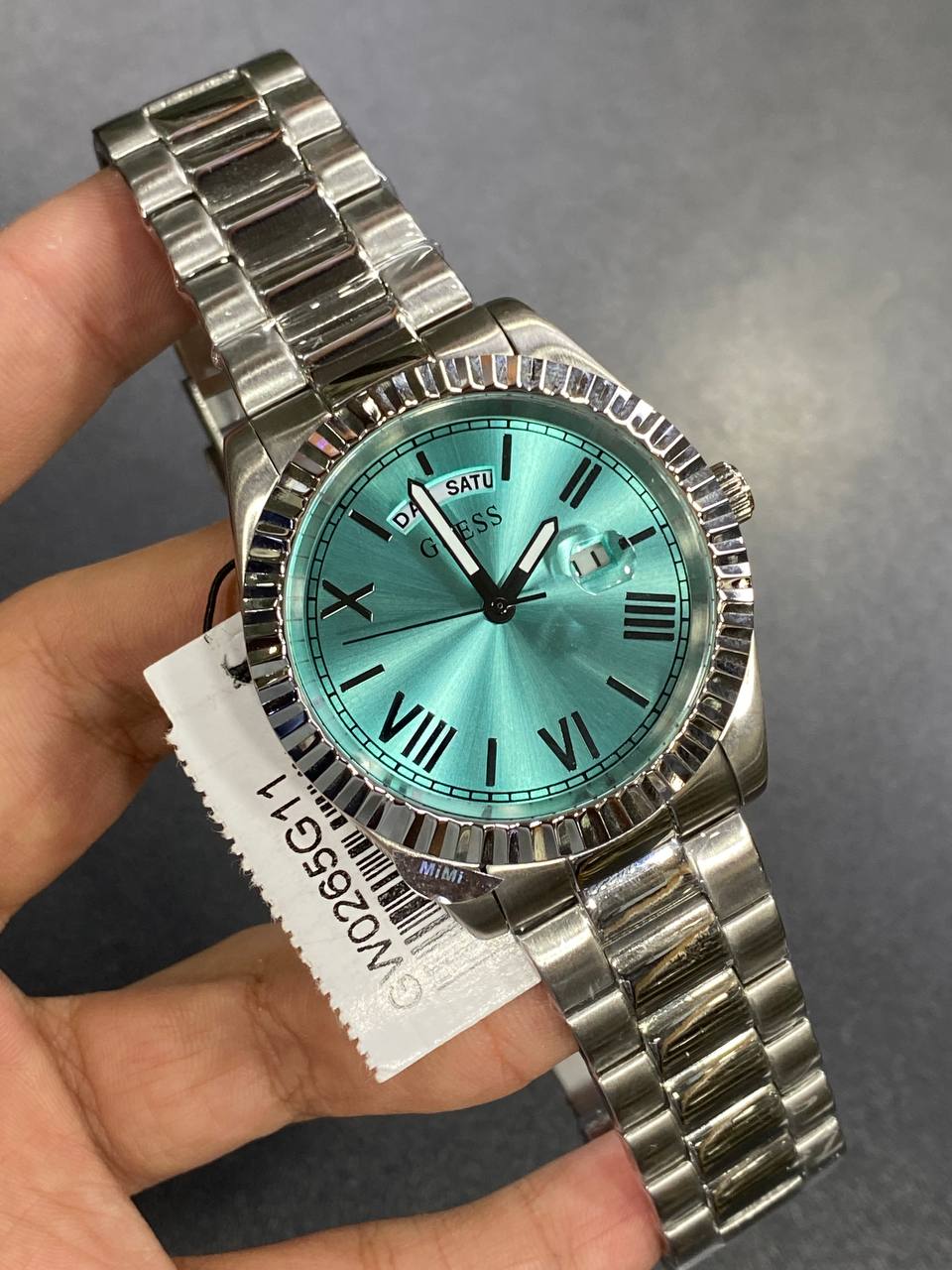 Authentic real-life photo of the Guess GW0265G11 showing actual silver shine and vibrant tiffany dial color in Egypt