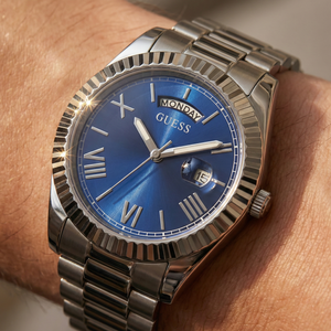 Close up shot of Guess GW0265G7 on wrist highlighting the blue dial and day date window